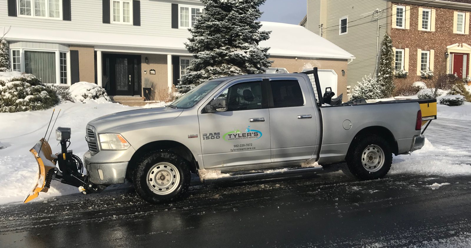 Branded TLC snow removal truck
